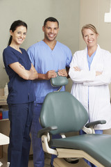 Obraz premium Portrait Of Dentist And Dental Nurses In Surgery
