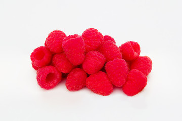 Handful of raspberries on isolated background