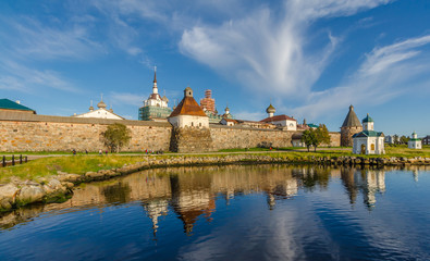 View of the Solovetsky Kremlin in the evening with reflection.