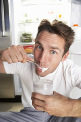 Man Raiding The Fridge At Night