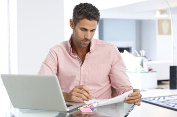 Fototapeta premium Man Working At Laptop In Home Office