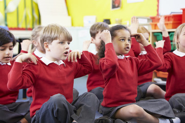 Pupils Perfoming Actions Whilst Singing Song