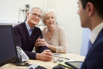 Senior Couple Meeting With Consultant In Hospital