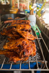Roast chicken leg on grill