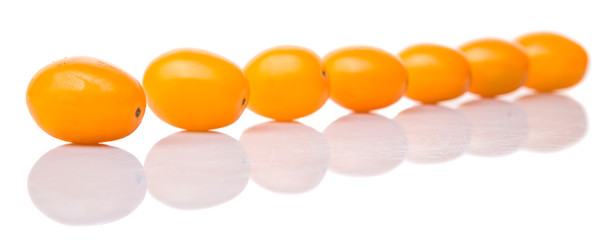 Yellow orange grape tomato over white background
