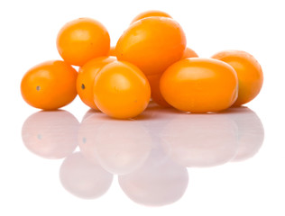 Yellow orange grape tomato over white background