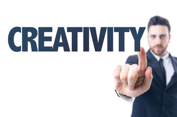 Business man pointing the text: Creativity