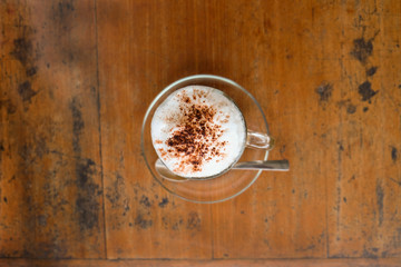 A cup of hot cappuccino and bread