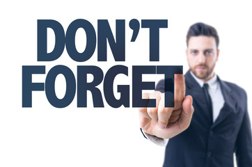 Business man pointing the text: Don't Forget