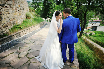 Young wedding couple in love on their wedding day