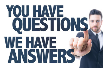 Business man point: You Have Questions We Have Answers