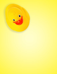 Rubber duck on yellow background