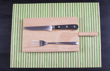 Fork and knife on wood