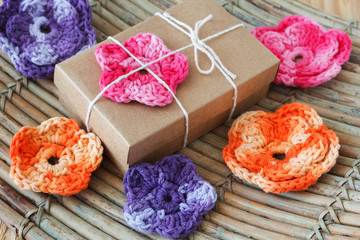 Fototapeta na wymiar Handmade colorful crochet flowers for gift