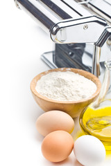 ingredients for preparing pasta and pasta machine