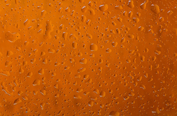 Texture water drops on the bottle of beer.