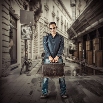 Young man traveller in street of european city