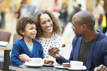 Family Enjoying Snack In CafÅ½ Together