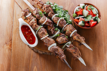 skewers shashlik kebab  with red sauce - 84469998