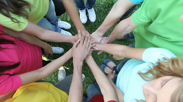 Closeup of stack of hands
