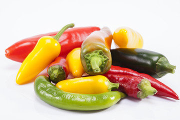 heap of colorful raw chili pepper  on white background