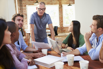 Group Of Office Workers Meeting To Discuss Ideas