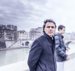 Handsome middle-aged man with worried look in Rome