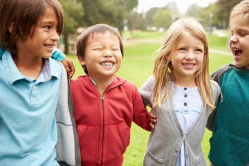 Group Of Young Children Hanging Out In Park