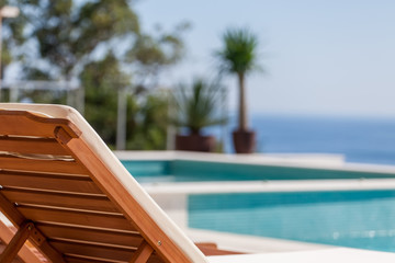 Luxury swimming pool and deck chair