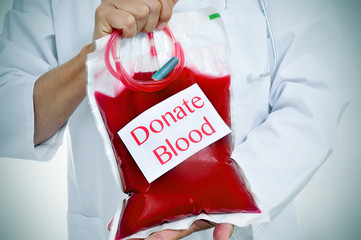 doctor holding a blood bag with the text donate blood