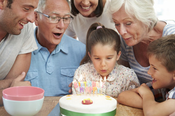 Obraz na płótnie Canvas Multi Generation Family Celebrating Daughter's Birthday