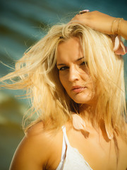 Portrait of blonde girl on beach