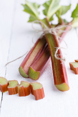 Rhubarb on white wooden table.