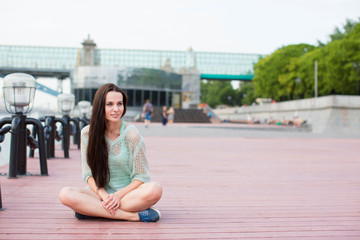 Beautiful girl sitting outdoors