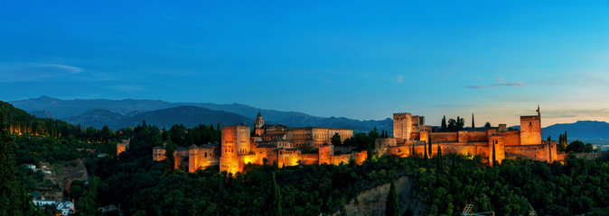 Aerial panoramic night view of Alhambra Palace in Granada, Spain