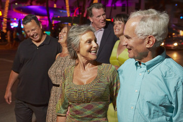 Group Of Senior Friends On Evening Out Together
