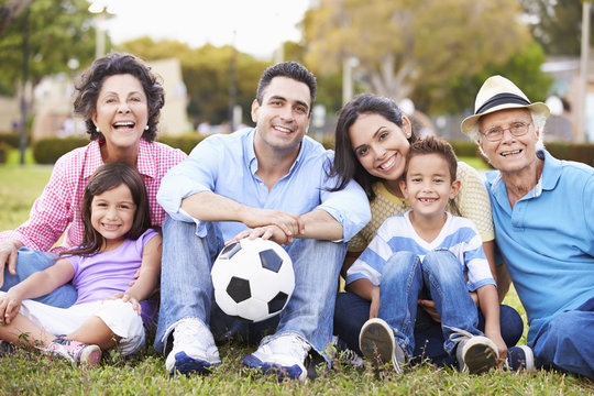 Multi Generation Family Playing Soccer Together