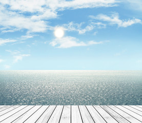Sea and sky in the daytime and wood slabs arranged in perspective background for design.