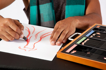 Black man's hands drawing