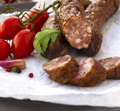 Smoked sausages with greens, cherry tomatoes 