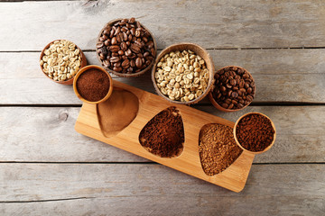 Various of coffee in small dishes on wooden table, top view