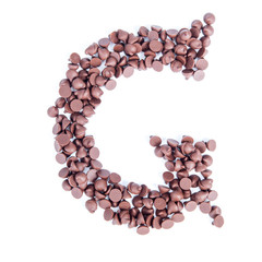 Alphabet from chocolate chips on white background