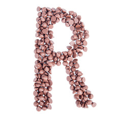 Alphabet from chocolate chips on white background