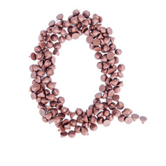 Alphabet from chocolate chips on white background
