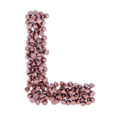 Alphabet from chocolate chips on white background