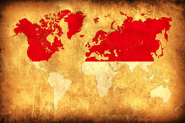 The flag of Indonesia in the outline of the world map