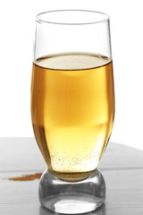 Glass of water with bubbles on table close up