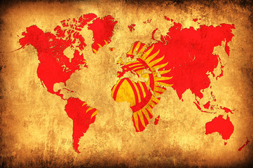 The flag of Kyrgyzstan in the outline of the world map
