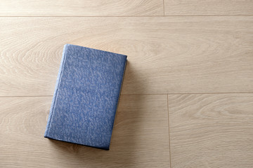 Old book on wooden background