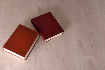 Old books on wooden background